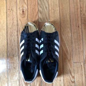 Adidas Superstar with gold toes